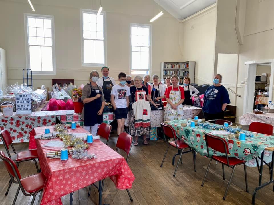 Volunteers help create a feast of generosity for Christmas at Junction 142.