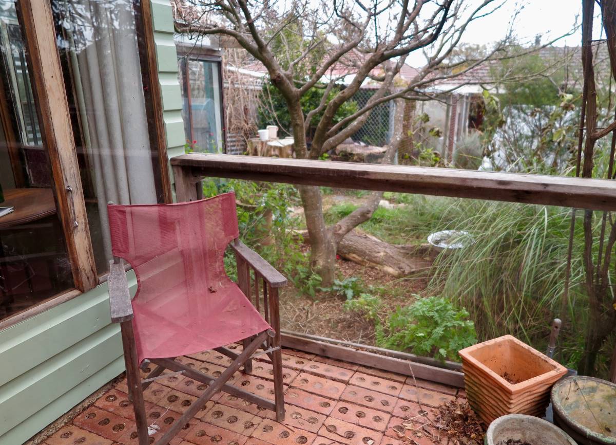 Glass partition on the studio verandah is an old shower door