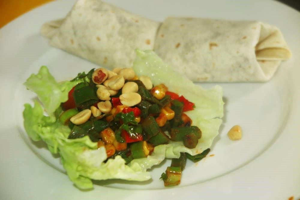 vegetable and lentil burrito and veg stir-fry in lettuce leaf